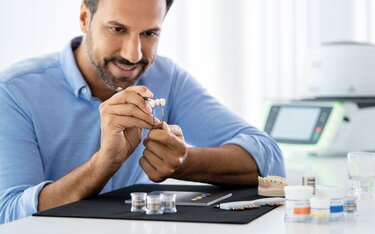 Male Dentist Crafting Meta-Ceramic restorations using Ivoclar dental materials